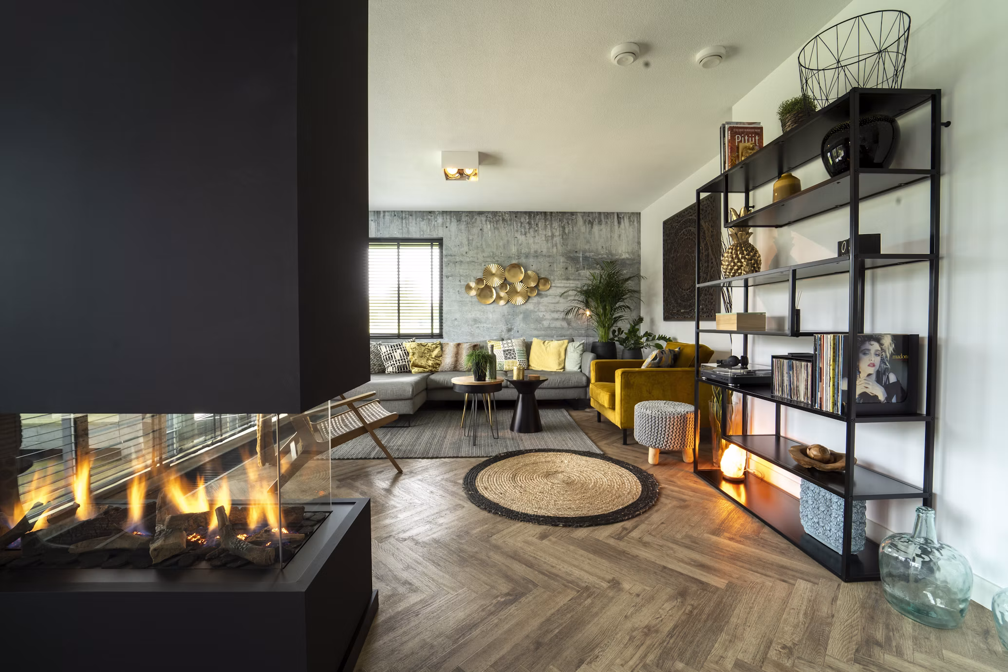Living room with a fireplace and sectional sofa, the listing's cover photo